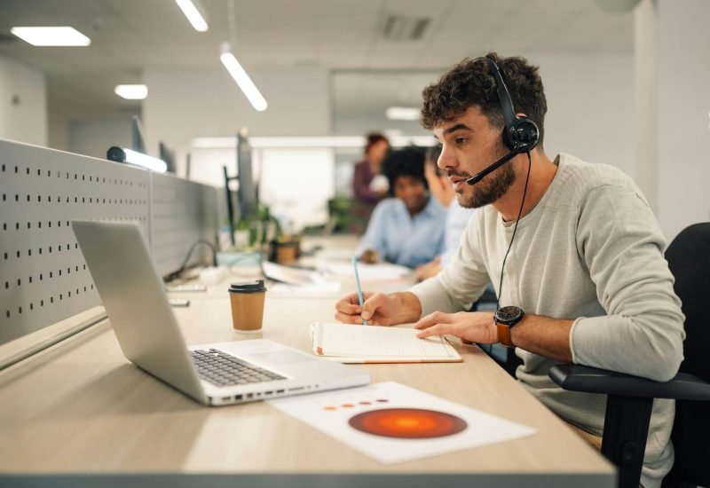 A-Virtual-Assistant-Is-Sitting-At-Call-Center-Department-And-Working-.Jpg